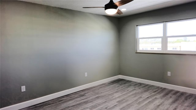 unfurnished room with ceiling fan and light wood-type flooring