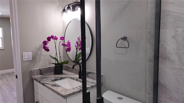 bathroom with vanity and toilet