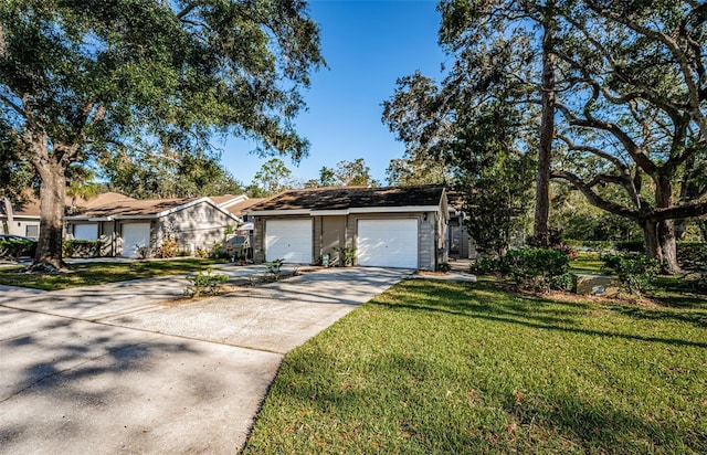 ranch-style house with a front yard and a garage