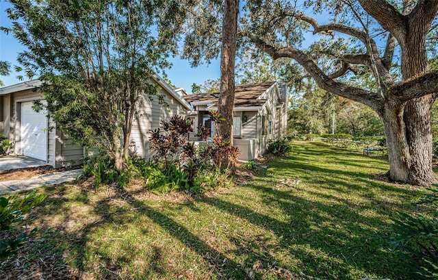 view of yard with a garage