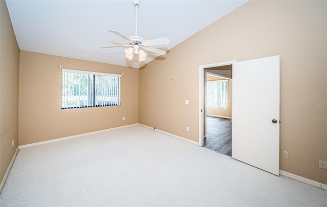 unfurnished room with ceiling fan, vaulted ceiling, and hardwood / wood-style floors