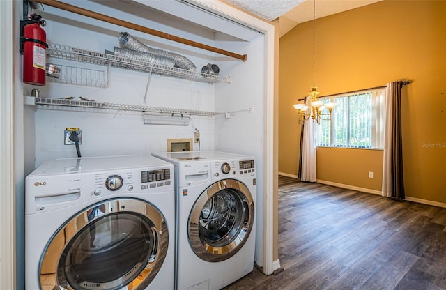 washroom featuring dark hardwood / wood-style floors, a chandelier, separate washer and dryer, and a textured ceiling