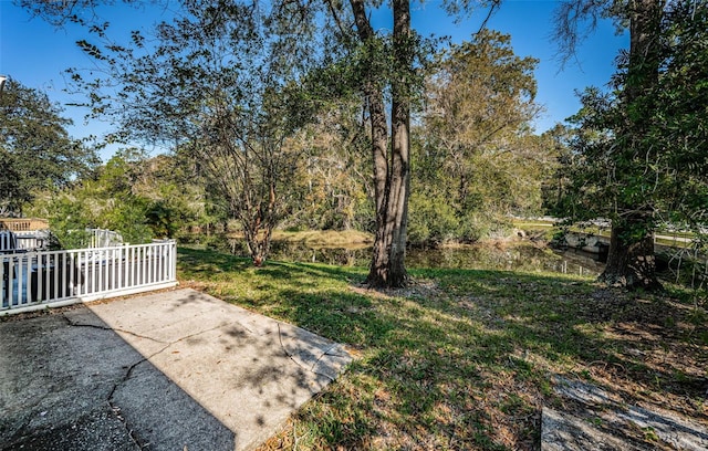 view of yard featuring fence and a patio area