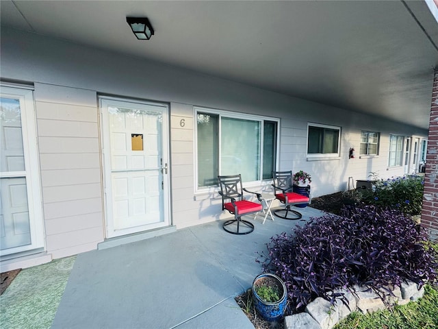 doorway to property with a patio area