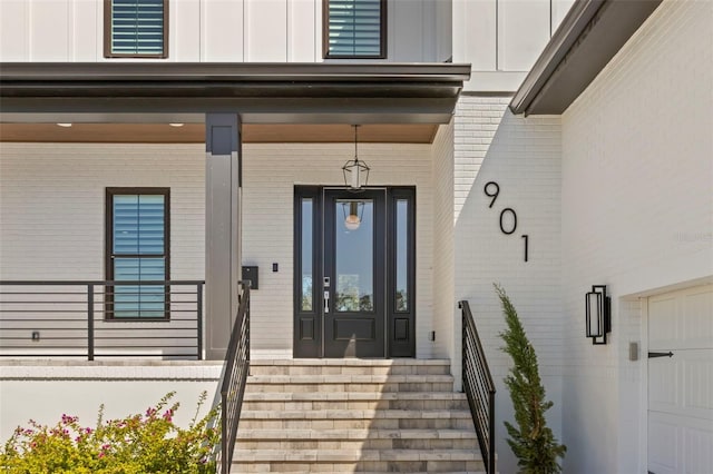 doorway to property featuring a garage