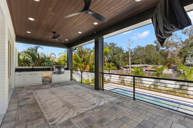 view of patio / terrace featuring an outdoor kitchen, a grill, and ceiling fan