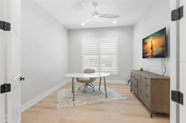 office space with light wood-type flooring and ceiling fan