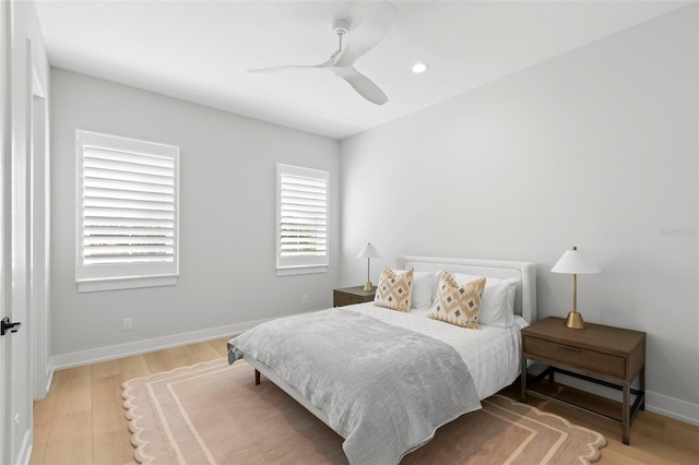 bedroom featuring hardwood / wood-style flooring and ceiling fan