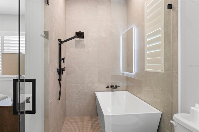 bathroom with toilet, tile patterned floors, tile walls, and shower with separate bathtub