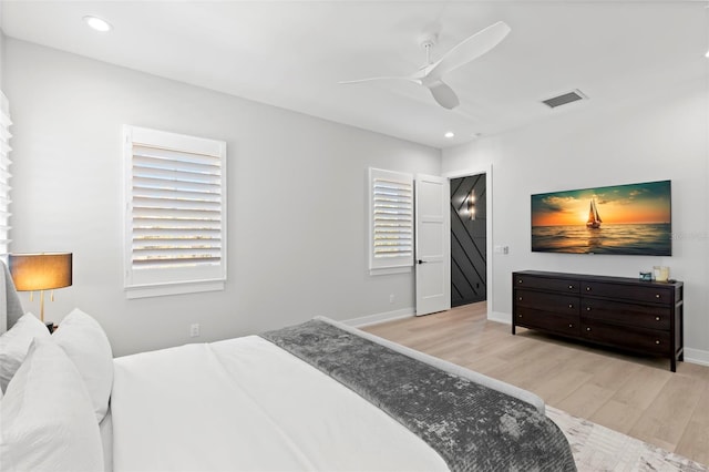 bedroom with ceiling fan and light wood-type flooring