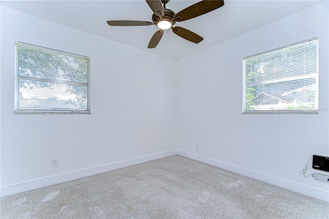 empty room with light carpet and ceiling fan