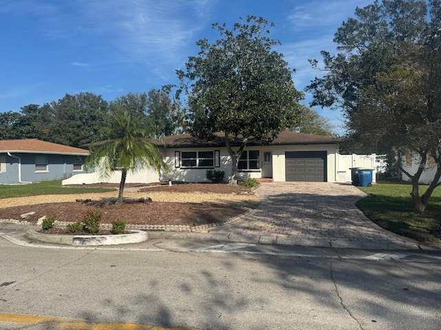 single story home with a garage