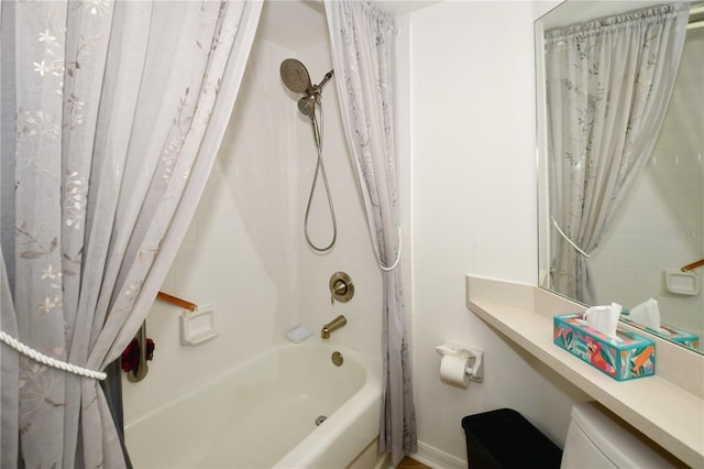 bathroom featuring shower / bath combo and toilet