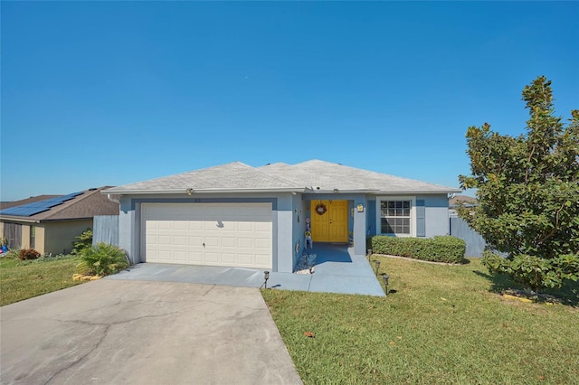 ranch-style house with a front lawn and a garage