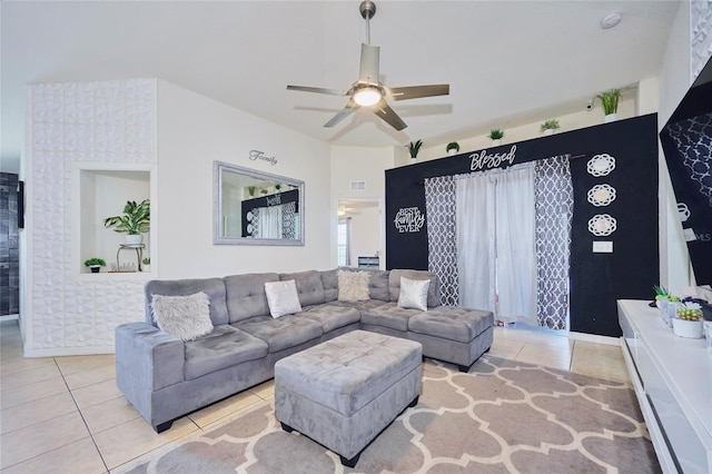 tiled living room featuring ceiling fan