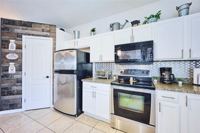 kitchen with decorative backsplash, white cabinetry, and stainless steel appliances