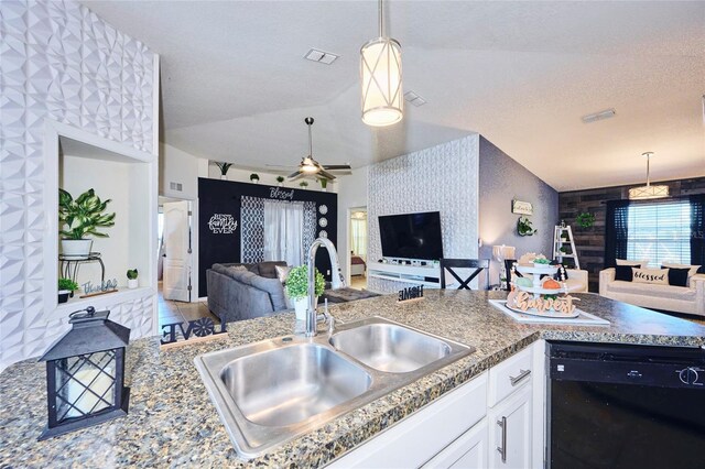 612 Chicago Way, Dundee, FL 33838 - kitchen with dishwasher, open floor plan, a sink, lofted ceiling, and pendant lighting