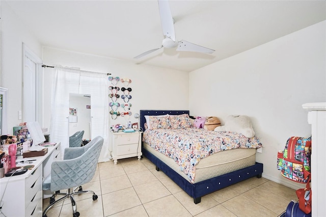 bedroom featuring light tile patterned flooring and ceiling fan