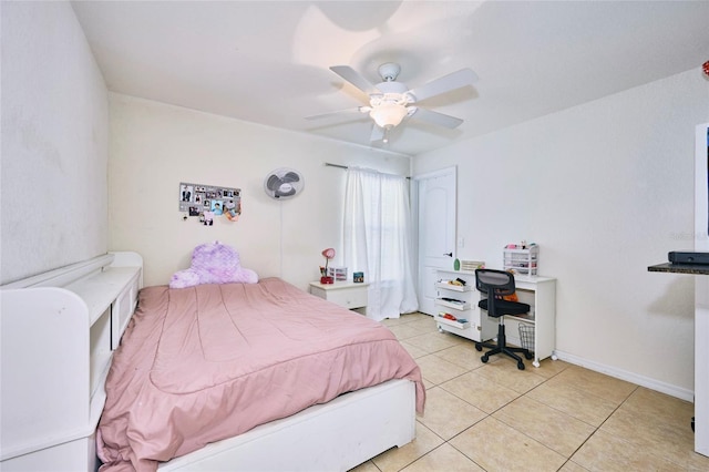 tiled bedroom with ceiling fan