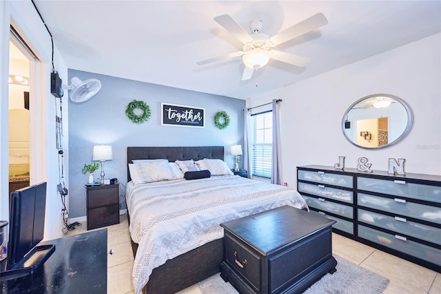 bedroom featuring light tile patterned floors and ceiling fan