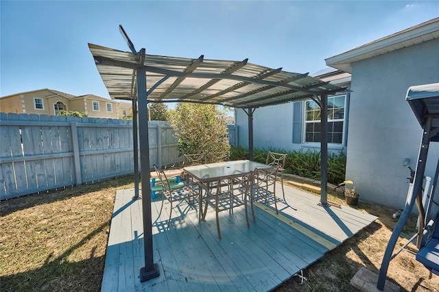 612 Chicago Way, Dundee, FL 33838 - deck featuring fence, a pergola, and outdoor dining area