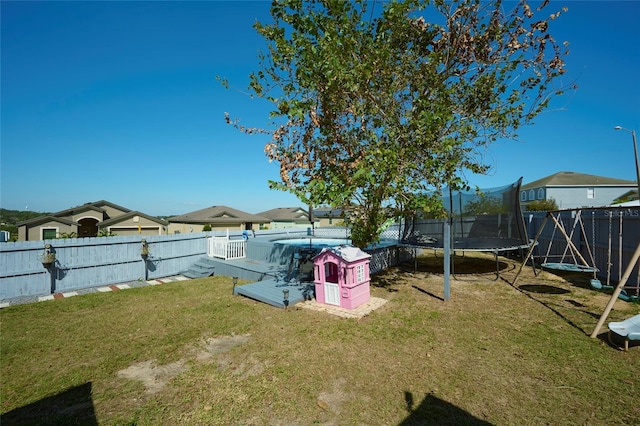 view of yard featuring a trampoline