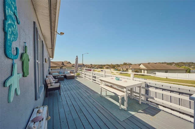 wooden deck featuring an outdoor living space