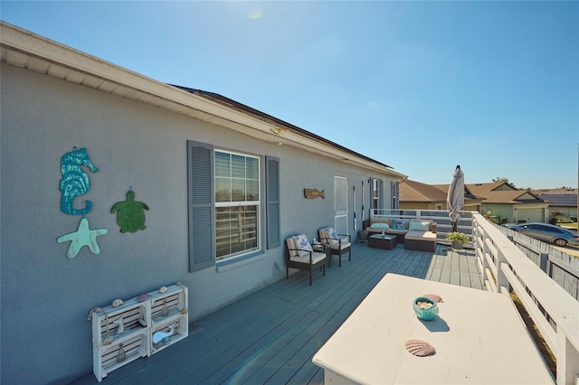 wooden deck with an outdoor hangout area