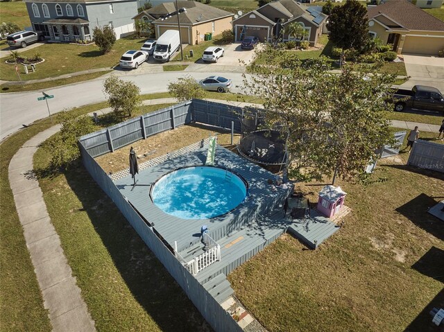 612 Chicago Way, Dundee, FL 33838 - aerial perspective of suburban area featuring a pool area