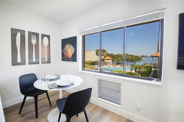 1515 Pinellas Bayway S Unit B28, Tierra Verde, FL 33715 - dining space featuring baseboards and wood finished floors