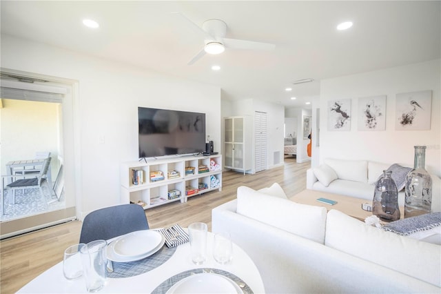 1515 Pinellas Bayway S Unit B28, Tierra Verde, FL 33715 - living area featuring wood finished floors, ceiling fan, recessed lighting, and baseboards