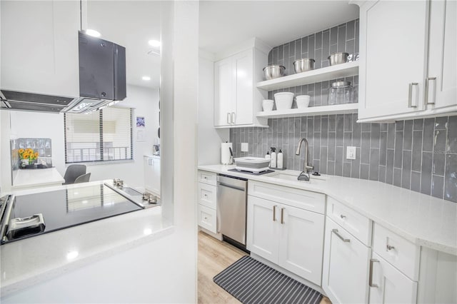 kitchen with white cabinetry, light wood-type flooring, dishwasher, decorative light fixtures, and sink