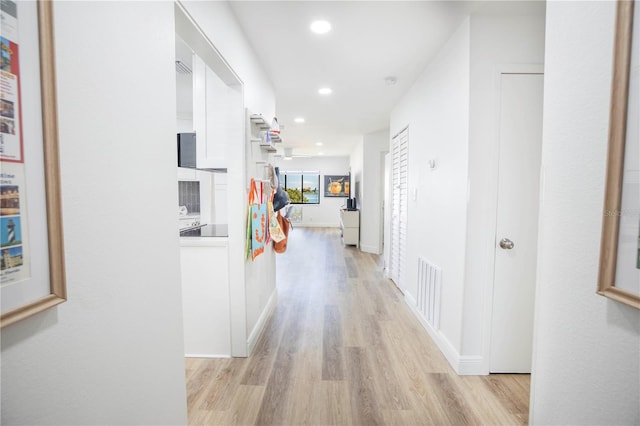 corridor featuring light wood-type flooring