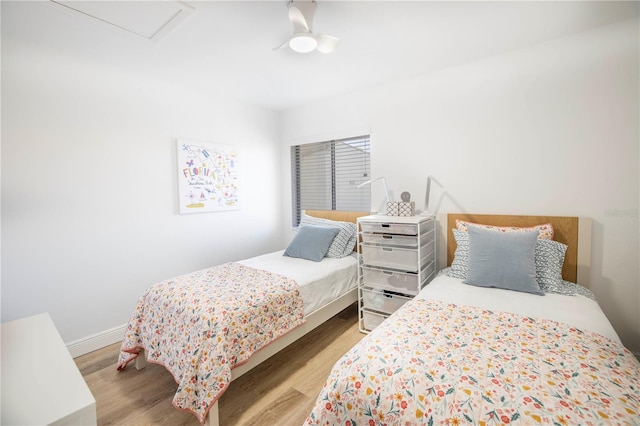 1515 Pinellas Bayway S Unit B28, Tierra Verde, FL 33715 - bedroom featuring wood finished floors, baseboards, attic access, and ceiling fan