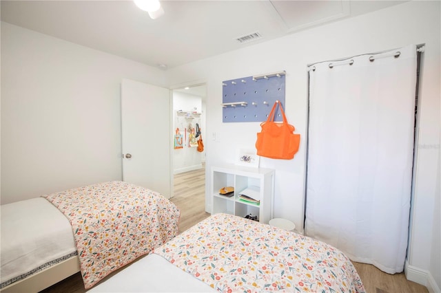 bedroom with ceiling fan and hardwood / wood-style floors