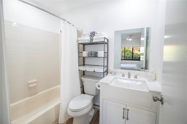 full bathroom with vanity, shower / bath combo with shower curtain, toilet, and hardwood / wood-style flooring