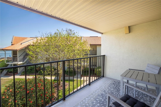 balcony featuring a water view