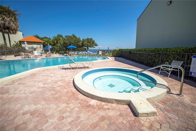 1515 Pinellas Bayway S Unit B28, Tierra Verde, FL 33715 - community pool featuring a hot tub and a patio