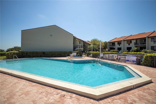 view of pool featuring a patio