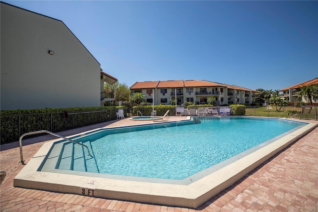 view of swimming pool featuring a patio