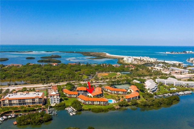 birds eye view of property with a water view