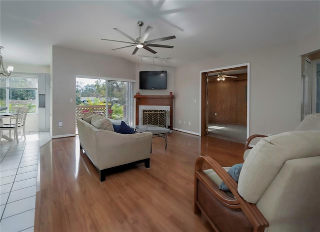 living room with hardwood / wood-style floors and a chandelier