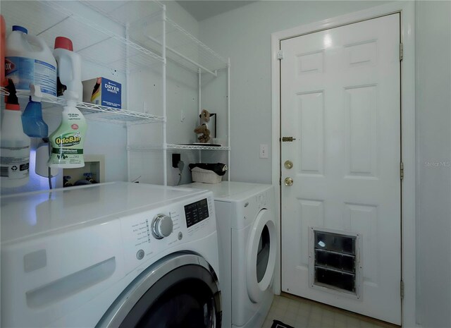 laundry area featuring washing machine and clothes dryer