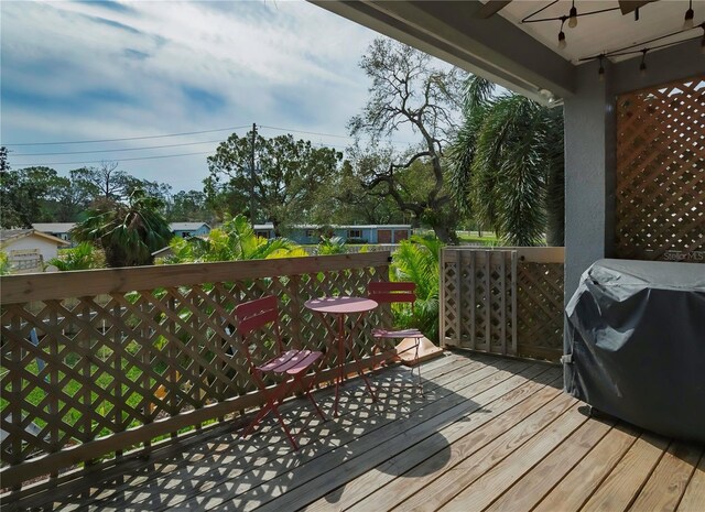 wooden deck featuring area for grilling