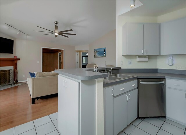 kitchen with ceiling fan, stainless steel dishwasher, kitchen peninsula, white cabinets, and light wood-type flooring