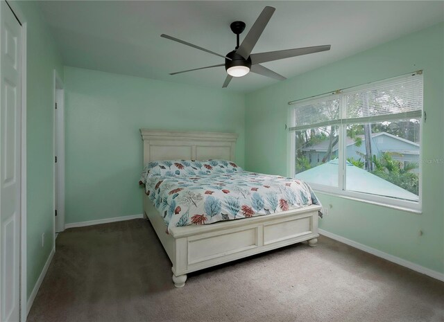 carpeted bedroom featuring ceiling fan