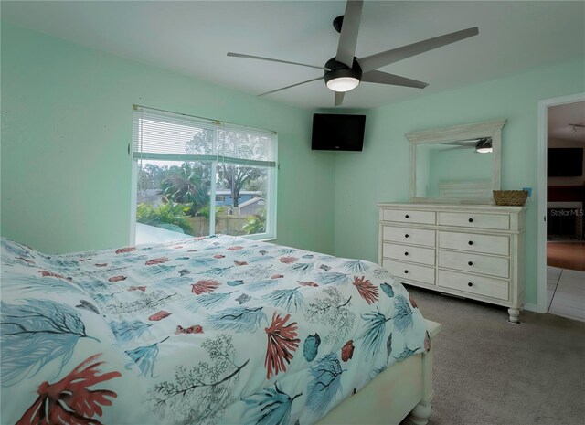 carpeted bedroom featuring ceiling fan