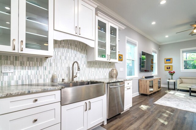 kitchen with sink, crown molding, stainless steel dishwasher, white cabinets, and light stone counters