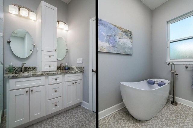 bathroom with vanity and a tub to relax in