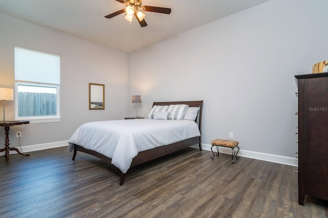 bedroom with ceiling fan and dark hardwood / wood-style flooring